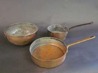 2 circular copper saucepans and a circular copper bowl