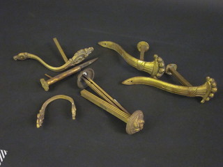 A collection of French gilt metal curtain retainers