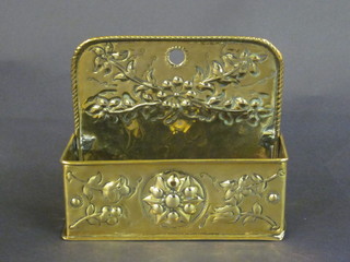 A rectangular embossed brass spill box with raised back 6 1/2"