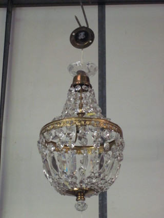 A circular gilt and glass light fitting