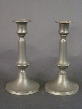 A pair of 18th/19th Century pewter candlesticks with ejectors 8"