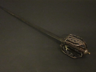 An 18th Century Scots broadsword with 34" blade, having a  pierced basket hilt