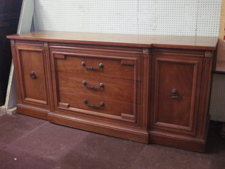 A Thomasville American cherry wood inverted breakfront  sideboard, fitted 3 long drawers flanked by a pair of cupboards  72"