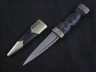 A Scottish Dirk with 3 1/2" blade complete with scabbard