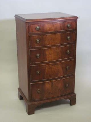 A Georgian style mahogany bow front chest of 5 long drawers, raised on bracket feet 21"