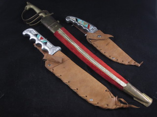 A reproduction Bowie knife with 7 1/2" blade, 1 other American  knife and a miniature reproduction Indian sabre with 11 1/2"  blade
