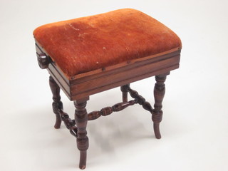 A Victorian rectangular mahogany adjustable piano stool, raised  on turned supports
