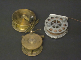 A brass centre pin fishing reel 3", 1 other 2 1/2" and an  aluminium centre pin fishing reel 2 1/2"