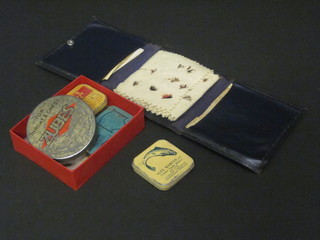 A fly wallet containing various flies etc