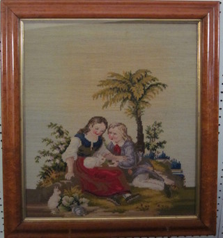 A Victorian Berlin woolwork panel depicting 2 seated children, contained in a maple frame 16" x 14"