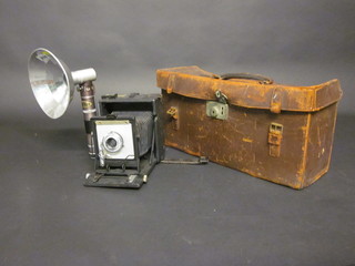 A 1930's Speed Graphic camera complete with leather carrying  case