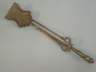 A Victorian brass coal shovel together with a pair of tongs