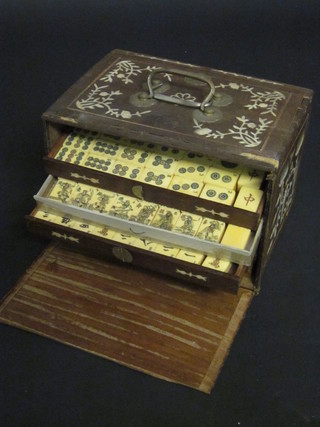 An ivory Mahjong set contained in a hardwood and inlaid ivory  case