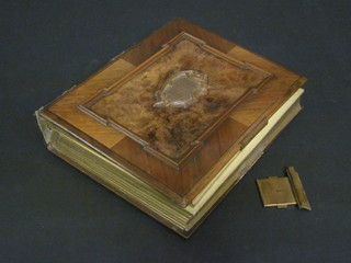 A Victorian wooden and leather bound photograph album