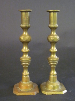 A pair of Victorian brass candlesticks with knopped stems 10"