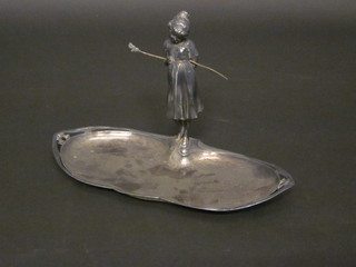 An Art Nouveau WMF style oval dish surmounted by a figure of  a standing girl, 13"  ILLUSTRATED