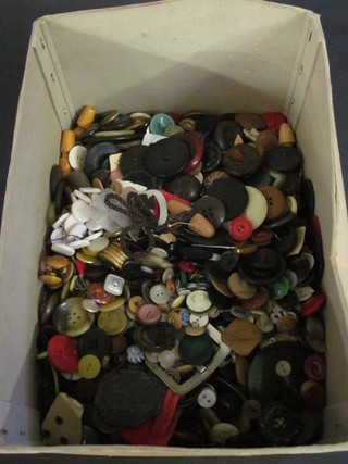 A box containing a collection of buttons