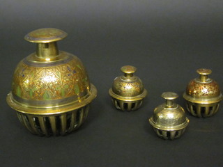 A set of 4 Eastern brass bells