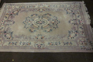 A cream ground and floral patterned Chinese rug 109" x 71"