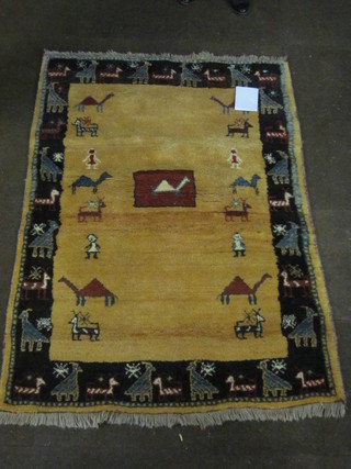 A modern Eastern yellow ground rug decorated animals 67" x  48"