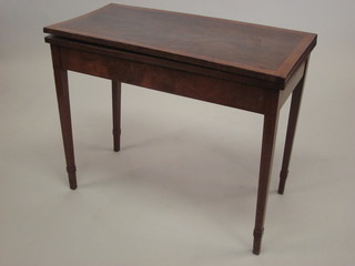 A 19th Century rectangular mahogany tea table with crossbanded top, raised on square tapering supports 36"