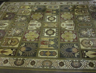 A green ground and floral patterned Persian style carpet 137" x  98"