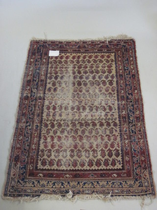 A Caucasian style rug with all-over geometric design 74" x 51",  worn,