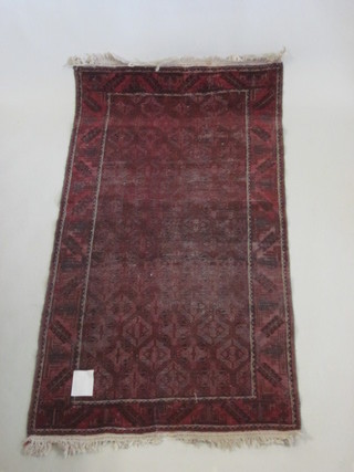 A red ground Afghan rug with multi-row borders, heavily worn,  81" x 42"