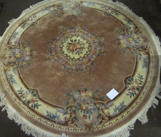 A circular brown ground and floral patterned Chinese carpet 110" diameter