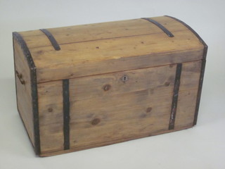 A Continental stripped and polished domed pine trunk with iron  banding 33"