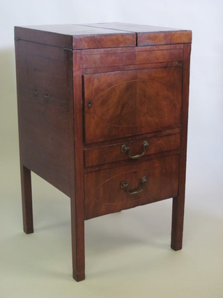 A Georgian mahogany enclosed washstand with hinged lid, the  base fitted a cupboard and drawer 20"