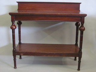 An Edwardian rectangular mahogany 2 tier buffet with raised  back, on turned supports 45"