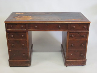 A Victorian mahogany kneehole pedestal desk with inset writing surface above 1 long and 8 short drawers 47"