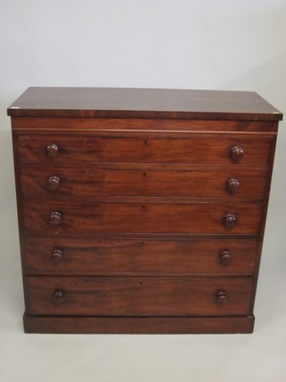 A Victorian mahogany chest of 5 long drawers with tore handles raised on a platform base 46"