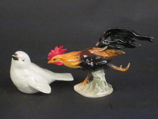 A Goebel figure of a seated white chick 4" and a Goebel figure  of a running cockerel