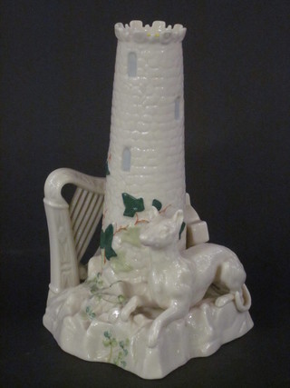 A Belleek vase in the form of a priests tower, the base decorated  a harp, Celtic cross and a seated Irish Wolf hound, the base with  brown Belleek mark 8"