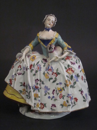 An 18th/19th Century Continental porcelain figure of a standing lady with 2 pugs, the base with cypher mark 9"