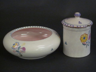 A circular Poole Pottery preserve jar and cover with floral  decoration, base impressed Poole England 286 3", together with  a circular Poole Pottery bowl, base impressed Poole England  221, 5", star crack to base