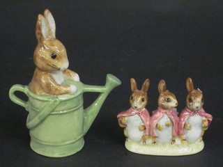 A Beswick Beatrix Potter figure - Peter in the Watering Can  together 1 other Flopsy Mopsy and Cottontail