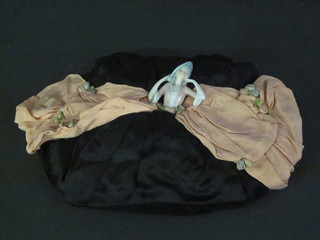 A fabric tea cosy in the form of a Crinoline lady with porcelain  head