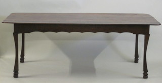 A Colonial hardwood farmhouse table, raised on shaped supports  84"