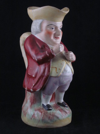 A 19th Century Staffordshire Toby jug in the form of Toby Philpots taking snuff 10"