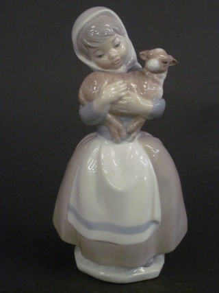 A Nao figure of a standing girl with lamb 8"