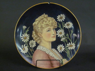A Victorian Continental pottery charger decorated a portrait of a  lady, the reverse marked Mary WS Hawkins 1882, chipped, 15  1/2"