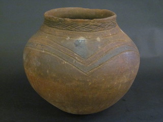 A West African globular shaped terracotta pot 12"   ILLUSTRATED