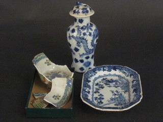 An Oriental blue and white club shaped urn and cover 6", the  base with 4 character mark, a blue and white lozenge shaped  dish, cracked and an Oriental bowl, heavily f,