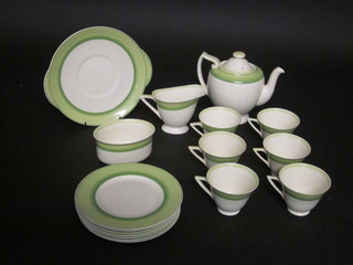 A 16 piece Art Deco Royal Doulton tea service comprising teapot, circular 9" bread plate, 7 tea plates, oval sugar bowl, oval  cream jug, 6 cups - 1 cracked, with green banded decoration, the  base marked V1283, RD 776716  ILLUSTRATED