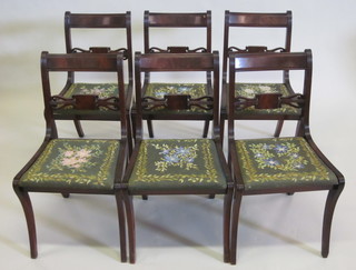 A set of 6 Regency style mahogany bar back dining chairs with  pierced mid rails