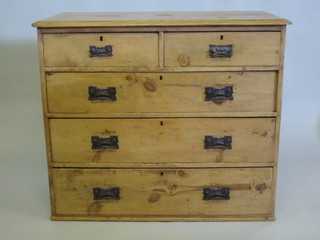 An Art Nouveau stripped and polished pine chest of 2 short and 3  long drawers with embossed metal handles 40"