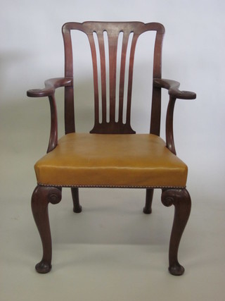 A Georgian mahogany slat back carver chair, raised on club  supports